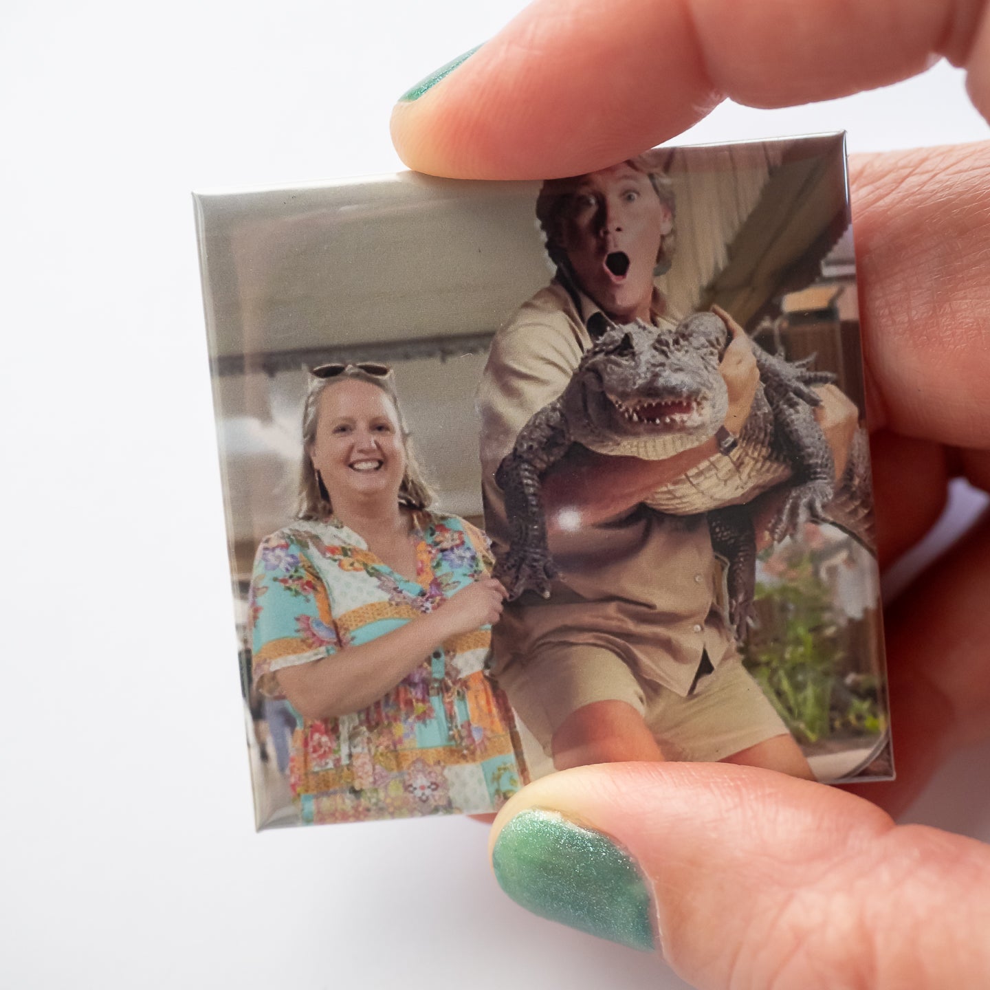 Hand holding a personalised photo magnet showing a photo of a woman (Melanie, owner of Attractive Memories) and a cutout of a man with an alligator (Steve Irwin).